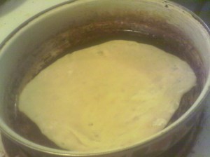 Cook on first side, bubbles may form, while rolling your next round