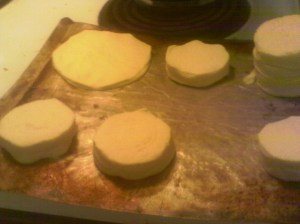 Flatten biscuits on greased cookie sheet 